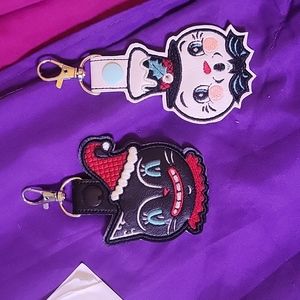 Two cartoon Christmas Keychains